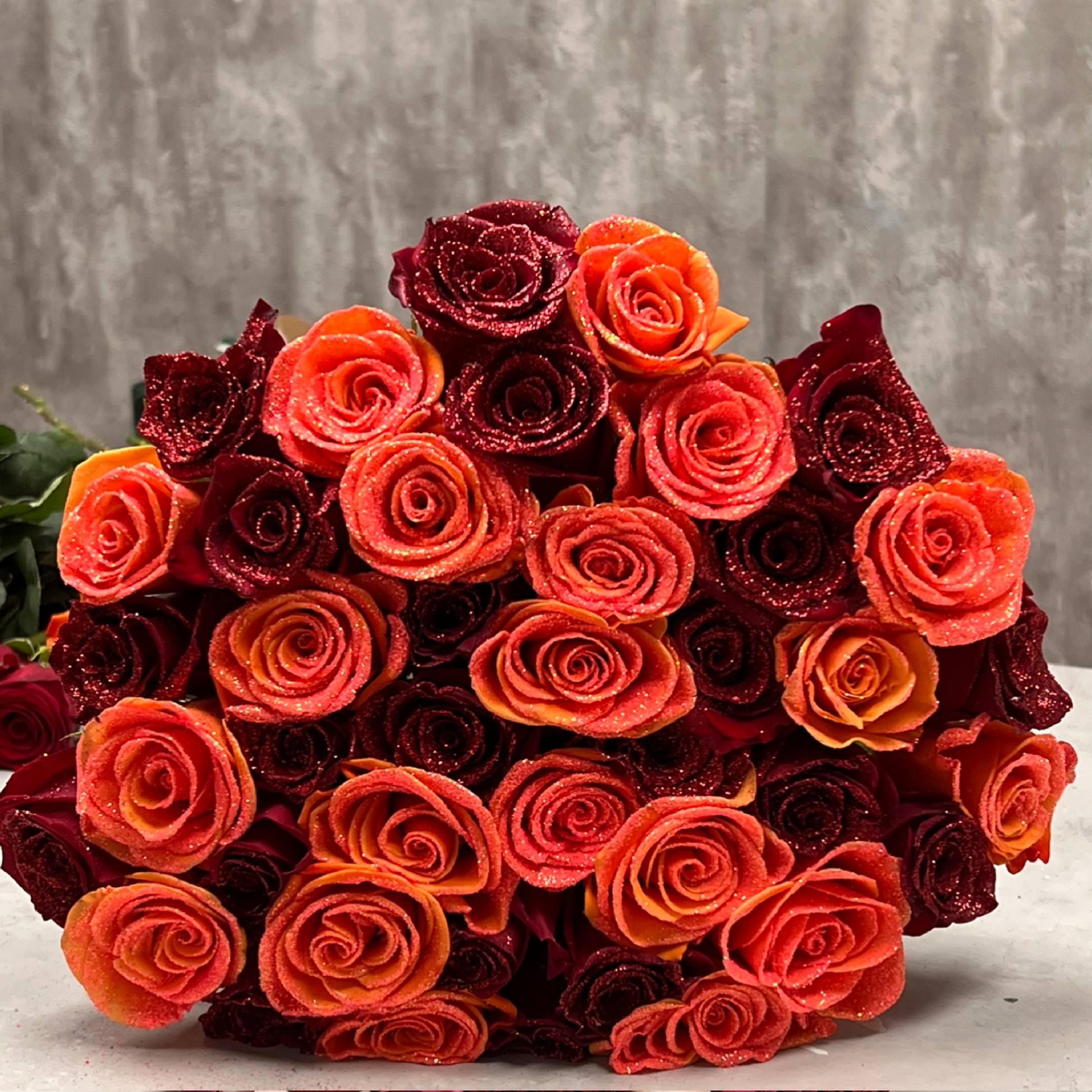A mesmerizing bouquet named 'Heart on Fire,' featuring a captivating combination of long-stem red and orange roses. Perfect for Valentine's Day, this unique arrangement expresses passion and affection. Same-day delivery available in Miami, FL. Best quality guaranteed for a truly memorable celebration.